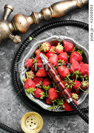 Stylish oriental shisha with strawberry Stylish oriental shisha with strawberry 41008993