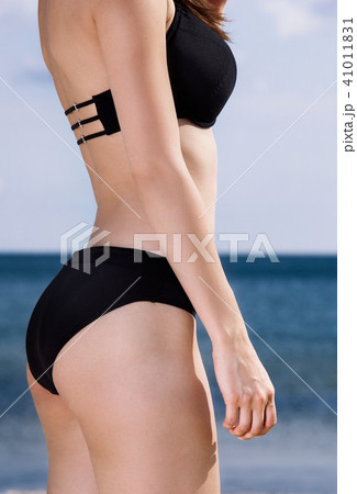 Body of young woman on beach Body of young woman on beach 41011831