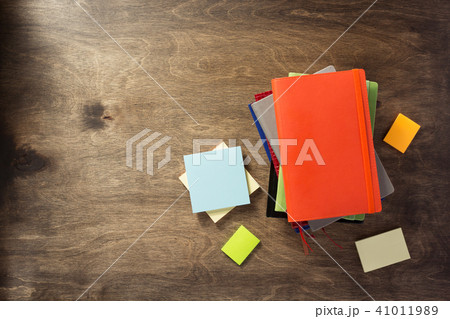 colorful notebook at wooden background 41011989