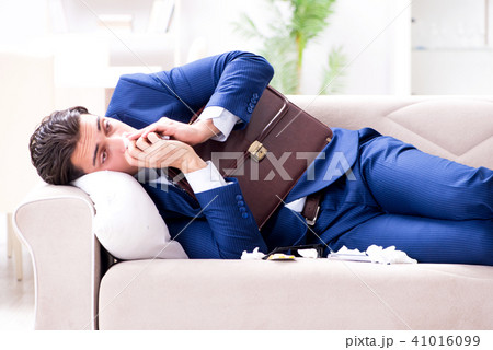 Sick employee staying at home suffering from flue 41016099