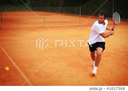 Tennis, player strong punches the ball Tennis, player strong punches the ball 41017368