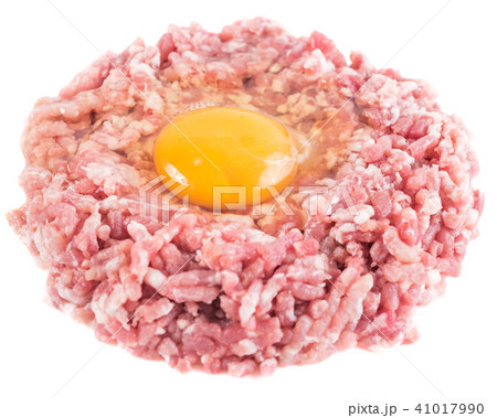 Raw hamburger with chicken egg yolk isolated 41017990