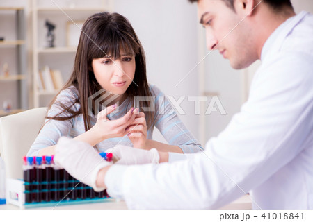 Patient during blood test sampling procedure taken for analysis Patient during blood test sampling procedure taken for analysis 41018841