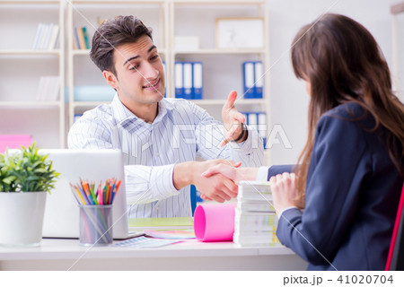 Pulisher discussing book order with customer Pulisher discussing book order with customer 41020704