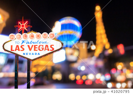 Famous Las Vegas sign with blur cityscape Famous Las Vegas sign with blur cityscape 41020795