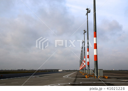 BERLIN, GERMANY - JAN 17th, 2015: View of empty apron with parking positions and lights. Tarmac at BERLIN, GERMANY - JAN 17th, 2015: View of empty apron with parking positions and lights. Tarmac at 41021228