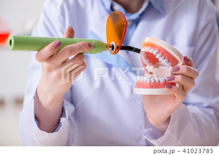 Dentist practicing work on tooth model Dentist practicing work on tooth model 41023785