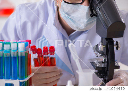 Female chemist working in hospital lab Female chemist working in hospital lab 41024450