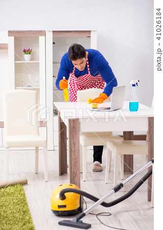 Contractor man cleaning house doing chores 41026184