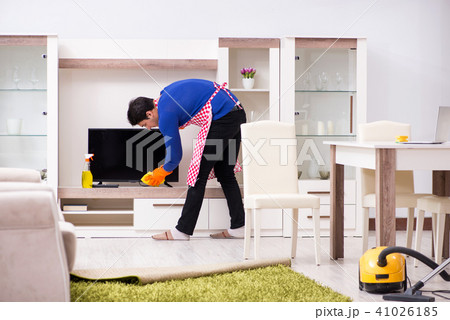 Contractor man cleaning house doing chores 41026185