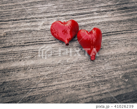 Red heart on concrete floor. Red heart on concrete floor. 41026239