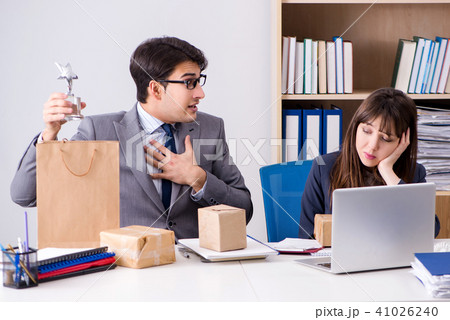 Business people receiving new mail and parcels Business people receiving new mail and parcels 41026240