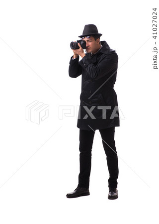 Spy with camera taking pictures isolated on white 41027024