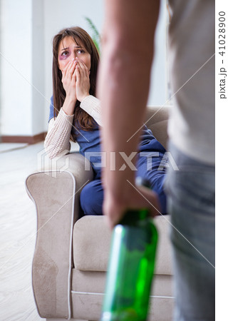 Drunk husband abusing wife in domestic violence concept Drunk husband abusing wife in domestic violence concept 41028900