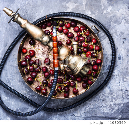 Stylish oriental shisha with cherries 41030549