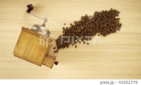 Coffee grinder with coffee beans on wooden  41032779