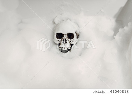 Scary human skeleton lying in the bathtub, humor 41040818
