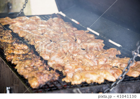 Spicy Grilled Jerk Chicken on the barbecue 41041130