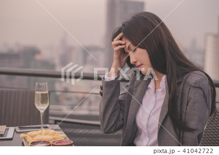 Concept of business celebrations. Asian businesswoman is drinkin Concept of business celebrations. Asian businesswoman is drinkin 41042722
