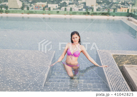 Swimsuit Concept. Beautiful girl wearing pink swimsuit. Beautifu Swimsuit Concept. Beautiful girl wearing pink swimsuit. Beautifu 41042825
