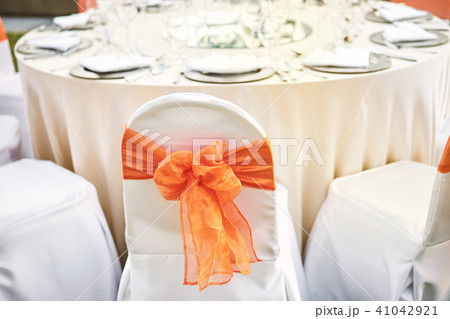 Spandex white cover chairs orange organza sash 41042921