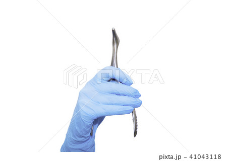 Nasal mirror in the hand in blue glove Nasal mirror in the hand in blue glove 41043118