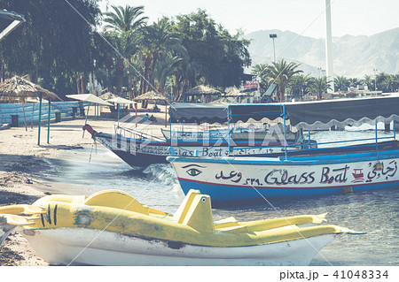 Touristic ships on the beach of Aqaba, Jordan. Pop Touristic ships on the beach of Aqaba, Jordan. Pop 41048334