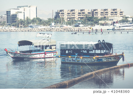 Touristic ships on the beach of Aqaba, Jordan. Pop 41048360