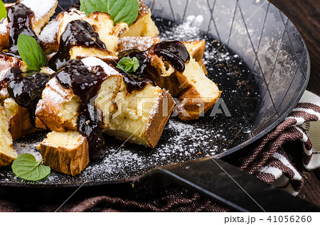 Cutted pancakes, Kaiserschmarrn delish dessert with plums Cutted pancakes, Kaiserschmarrn delish dessert with plums 41056260