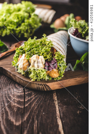 Grilled tortilla with chicken, mayo and tomato ketchu....Grilled tortilla chicken, lettuce, homemade mayo and barbeque sauce Grilled tortilla with chicken, mayo and tomato ketchu....Grilled tortilla chicken, lettuce, homemade mayo and barbeque sauce 41056981