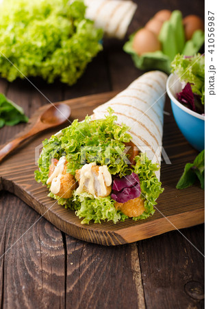 Grilled tortilla with chicken, mayo and tomato ketchu....Grilled tortilla chicken, lettuce, homemade mayo and barbeque sauce 41056987