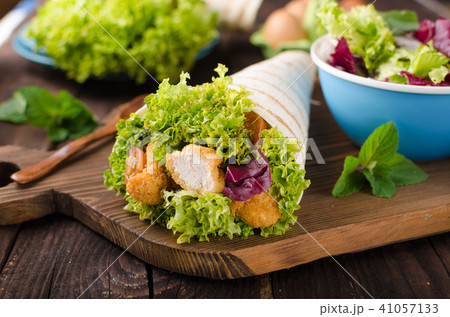 Grilled tortilla with chicken, mayo and tomato ketchu....Grilled tortilla chicken, lettuce, homemade mayo and barbeque sauce Grilled tortilla with chicken, mayo and tomato ketchu....Grilled tortilla chicken, lettuce, homemade mayo and barbeque sauce 41057133