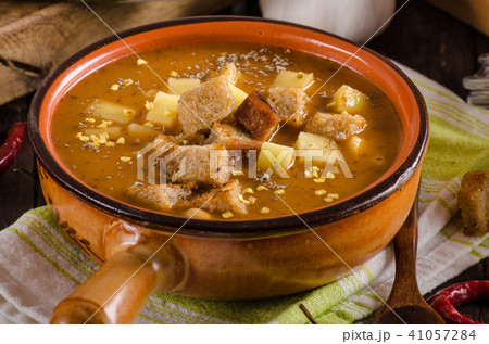 Goulash soup with croutons and potatoes Goulash soup with croutons and potatoes 41057284