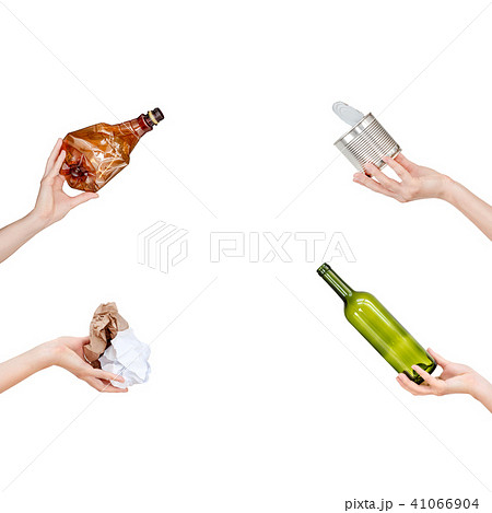 Hands holding crumpled paper, empty glass and plastic bottles, tin can isolated on white background Hands holding crumpled paper, empty glass and plastic bottles, tin can isolated on white background 41066904