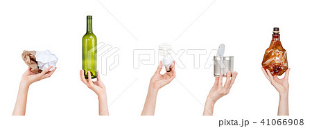 Hands holding crumpled paper, bulb, glass and plastic bottles, tin can isolated on white background Hands holding crumpled paper, bulb, glass and plastic bottles, tin can isolated on white background 41066908
