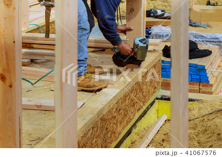 Building contractor worker with air nailgun nailer Building contractor worker with air nailgun nailer 41067576