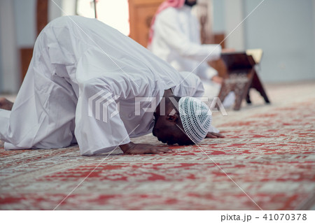 African Muslim Man Making Traditional Prayer To God While Wearing Dishdasha 41070378