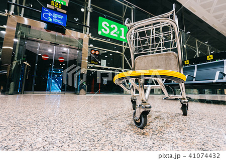 Luggage cart trolley at modern airport gate 41074432