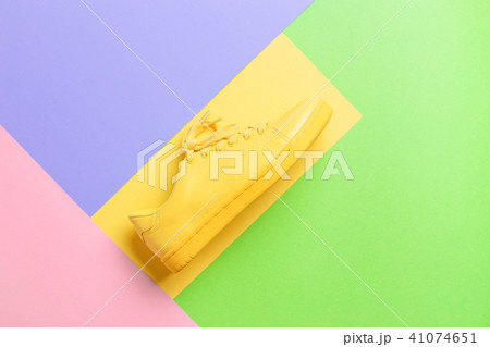 Conceptual image with yellow shoe. Conceptual image with yellow shoe. 41074651
