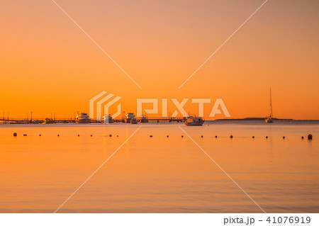 sunrise on the red sea ships and pier orange sky sunrise on the red sea ships and pier orange sky 41076919