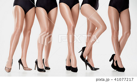 Group from beautiful young women posing isolated on a white background Group from beautiful young women posing isolated on a white background 41077217