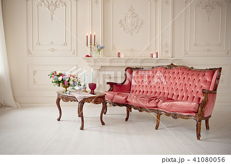 baroque style interior with red luxury sofa and table 41080056
