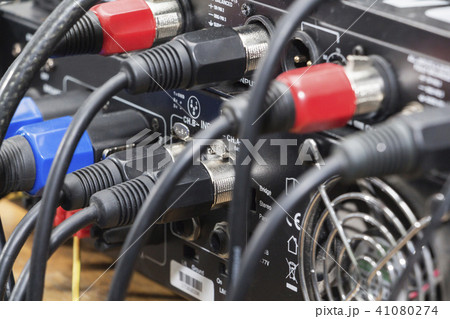 audio jack and wires connected to audio mixer, music dj equipment at concert, festival, bar. audio jack and wires connected to audio mixer, music dj equipment at concert, festival, bar. 41080274