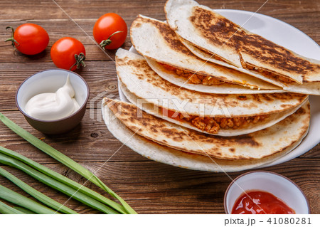 Quesadilla with chicken, tomatoes, dressing Quesadilla with chicken, tomatoes, dressing 41080281