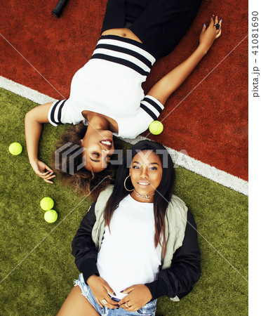 young pretty girlfriends hanging on tennis court, fashion stylis 41081690