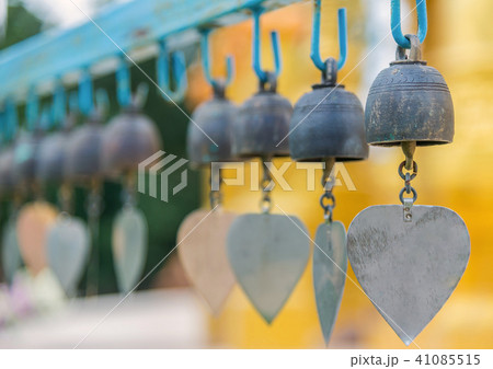 Row of golden bells in buddist temple at Thailand 41085515