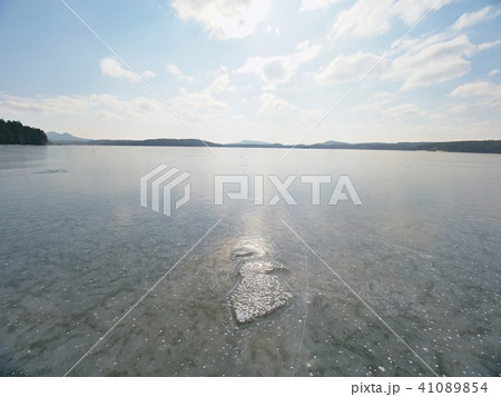 Beautiful transparent piece Lake ice against sky Beautiful transparent piece Lake ice against sky 41089854