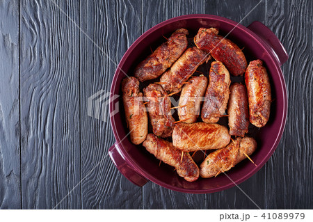 fried rolls of pounded beef steaks 41089979