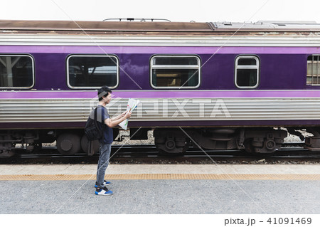 traveler with map at train station traveler with map at train station 41091469