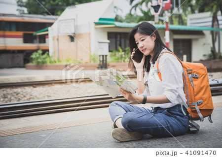 traveler with map at train station 41091470